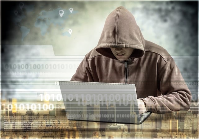 cyber-hacker-using-laptop-dark-background