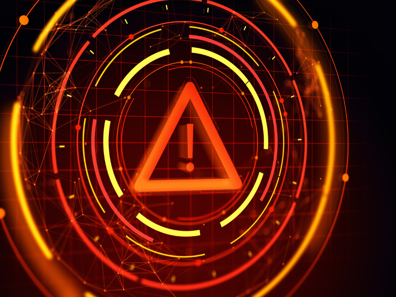 Red triangular warning symbol with digital circular patterns.
