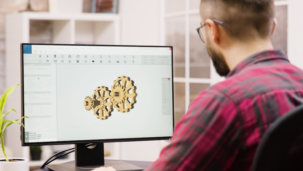 male-engineer-working-3d-design-from-home-girlfriend-background