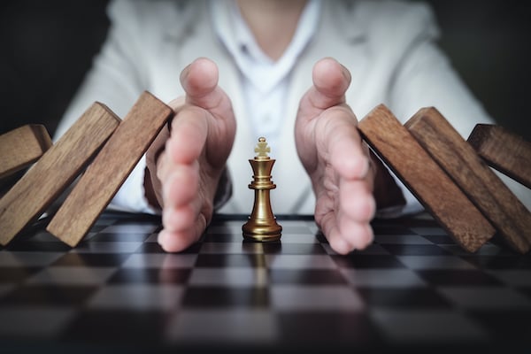 preventing-risk-playing-chess-business-board-business-insurance-concept