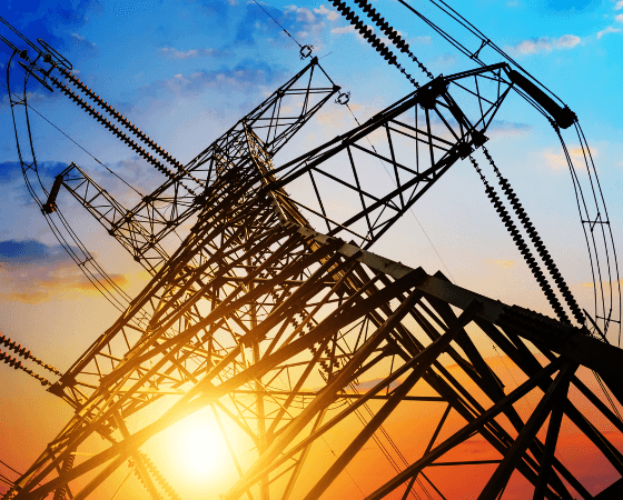 Electrical transmission tower silhouetted against a sunset sky. Electrical transmission tower silhouetted against a sunset sky.